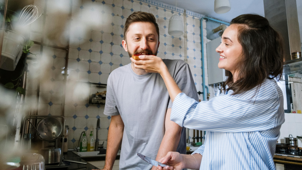 A couple smiling, connecting over eating - symbolizing recovery from PTSD